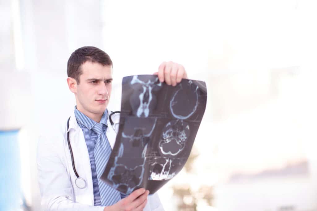 X-ray radiography produces images to detect internal body abnormalities.