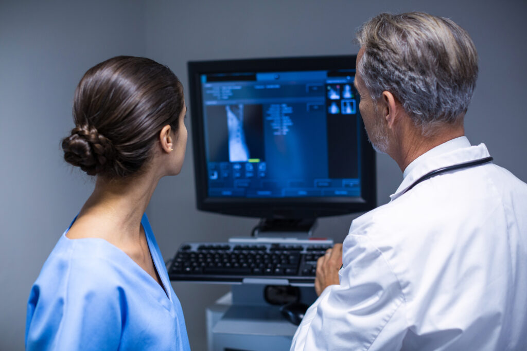 A radiology nurse assists patients during imaging procedures and ensures their safety